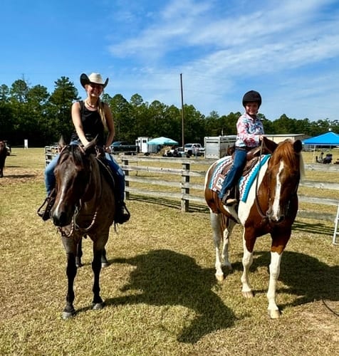 Western reining horse and rider in arena